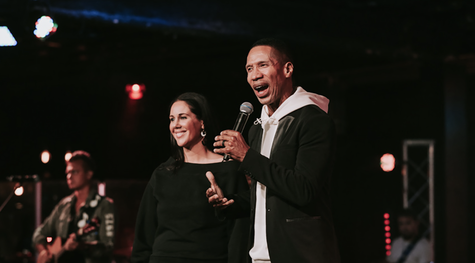 Sean and Christa Smith ministering to a crowd of people.